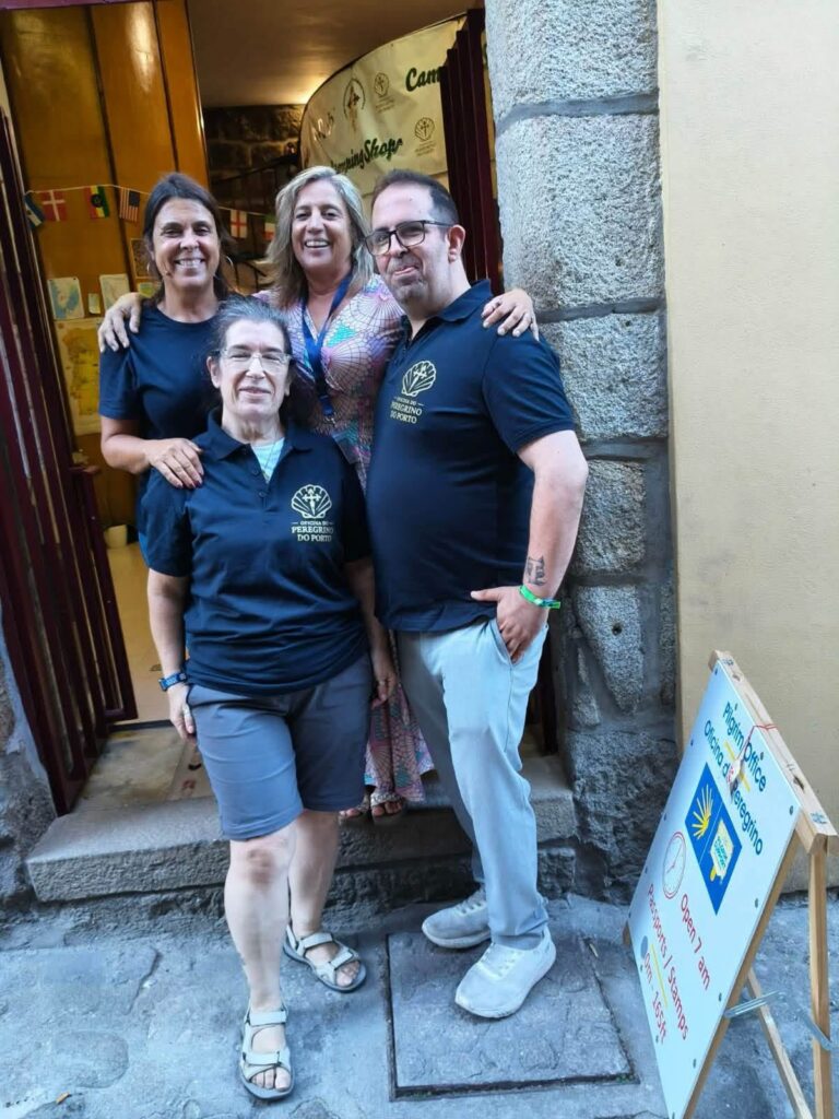 The team of the Oficina do Peregrino do Porto in their new polo shirts outside the pilgrim office